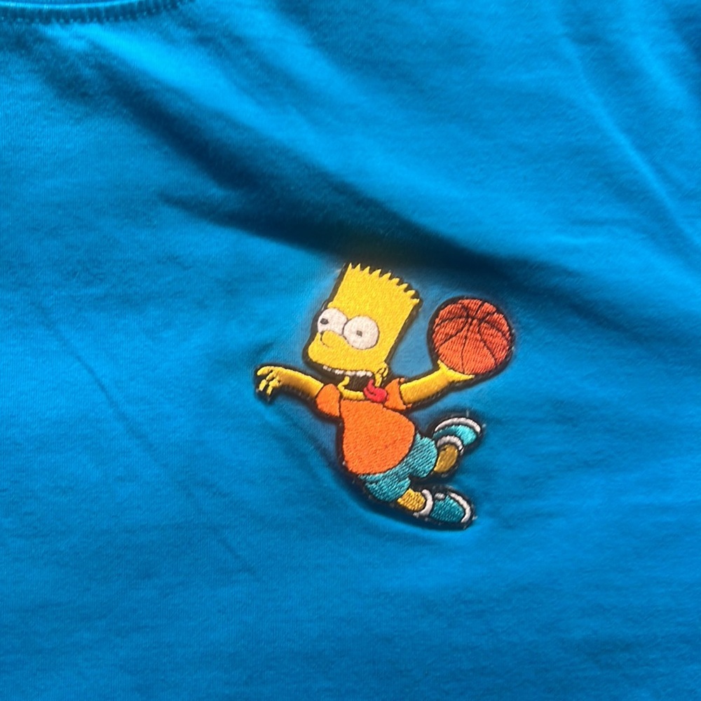 The Simpsons T-shirt with Bart dunking. Very soft shirt material.